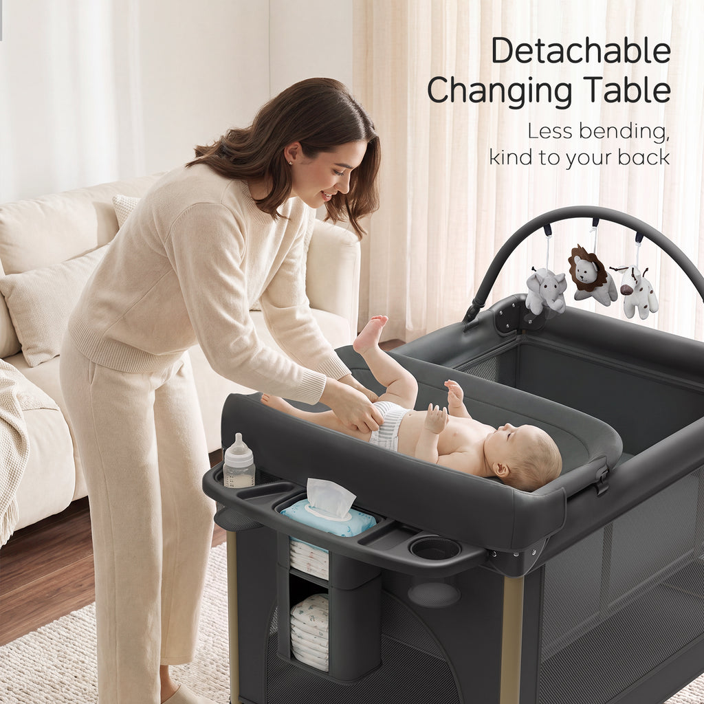 PRVAETU 4 in 1 Baby Playard with Changing Table & Mattress & 4 Movable Wheels & Toy Bar & Storage Bag, Bedside Bassinet Sleeper for Newborn